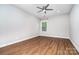 Bright and airy bedroom with hardwood floors, a ceiling fan, and a window for natural light at 15637 Guthrie Dr, Huntersville, NC 28078