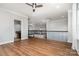 Spacious bonus room featuring elegant chandelier and railings and hardwood flooring at 15637 Guthrie Dr, Huntersville, NC 28078
