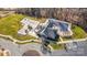Aerial view of a community pool and playground featuring ample parking, and green space at 15637 Guthrie Dr, Huntersville, NC 28078