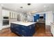 Open kitchen featuring a large center island with granite countertops and stainless steel appliances at 15637 Guthrie Dr, Huntersville, NC 28078