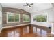 Bright living room featuring hardwood floors, natural light, and custom wood accent wall at 15637 Guthrie Dr, Huntersville, NC 28078