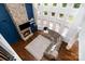 Bright living room with a stone fireplace and large windows at 15637 Guthrie Dr, Huntersville, NC 28078
