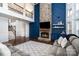 Elegant living room with a stone fireplace and cozy seating arrangement at 15637 Guthrie Dr, Huntersville, NC 28078