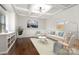 Inviting living room featuring stylish decor, hardwood floors, and ample natural light at 15637 Guthrie Dr, Huntersville, NC 28078