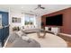 Bright living room featuring a modern sofa, stylish coffee table, and comfortable beanbag chairs at 15637 Guthrie Dr, Huntersville, NC 28078