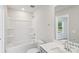 Bathroom with a tub, toilet, vanity sink with white countertop, and a view of a window at 1712 Braemar Village Dr, Monroe, NC 28110