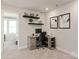 Functional home office with a built-in desk and open shelving at 1712 Braemar Village Dr, Monroe, NC 28110