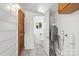Secondary bathroom with tile flooring, toilet, and tankless water heater at 1725 Fallston Rd, Shelby, NC 28150
