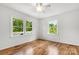 Bright bedroom featuring many windows for natural lighting and gorgeous hardwood floors at 1725 Fallston Rd, Shelby, NC 28150