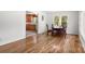 Sunlit dining area featuring hardwood floors and views into the cozy adjacent kitchen at 1725 Fallston Rd, Shelby, NC 28150