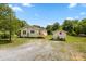 Quaint single-story home featuring a storage shed and ample parking at 1725 Fallston Rd, Shelby, NC 28150