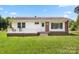 Charming single-story home with a well-manicured lawn, brick accents, and a cozy front porch at 1725 Fallston Rd, Shelby, NC 28150
