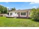 Inviting single-story home featuring a brick foundation, covered porch, and lush green lawn at 1725 Fallston Rd, Shelby, NC 28150