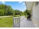 Relaxing front porch featuring a white railing and a comfortable rocking chair at 1725 Fallston Rd, Shelby, NC 28150