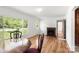 Open-concept living area featuring hardwood floors, natural light, and a cozy fireplace at 1725 Fallston Rd, Shelby, NC 28150