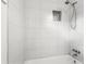 A shower featuring white subway tile and a shower niche at 1725 Fallston Rd, Shelby, NC 28150