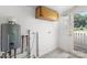 Utility room featuring a tankless water heater and access to the exterior at 1725 Fallston Rd, Shelby, NC 28150