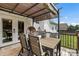 Enjoy outdoor dining on this charming back porch with a pergola and seating at 1759 Nw Pipers Ridge Cir, Conover, NC 28613