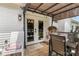 Back porch featuring an outdoor dining and lounge area, perfect for relaxing and entertaining at 1759 Nw Pipers Ridge Cir, Conover, NC 28613