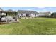 Expansive backyard featuring a deck, gazebo, and plenty of green space at 1759 Nw Pipers Ridge Cir, Conover, NC 28613