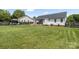 Expansive backyard with a gazebo, deck, mature lawn, and privacy fence offers outdoor entertaining at 1759 Nw Pipers Ridge Cir, Conover, NC 28613