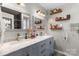 Bathroom featuring a double sink vanity with stone countertop and chrome faucets at 1759 Nw Pipers Ridge Cir, Conover, NC 28613