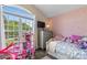 Charming bedroom with a large window and a fun, girly decorative theme at 1759 Nw Pipers Ridge Cir, Conover, NC 28613
