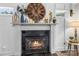 Close-up of the fireplace showing the beautiful mantle with decor and adjacent sitting area at 1759 Nw Pipers Ridge Cir, Conover, NC 28613
