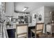 Beautiful kitchen with stainless steel appliances, bright white cabinets and a breakfast bar at 1759 Nw Pipers Ridge Cir, Conover, NC 28613