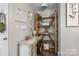 Cozy office nook features a decorative desk, custom shelving, and a comfortable seating area at 1759 Nw Pipers Ridge Cir, Conover, NC 28613