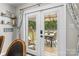 Charming patio view through glass doors showcases outdoor dining and a swing chair at 1759 Nw Pipers Ridge Cir, Conover, NC 28613