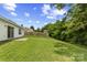 Expansive, green backyard with a well-maintained lawn and privacy fence at 181 Mott Rd, Mooresville, NC 28115