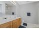 Bathroom featuring double sinks, large mirror and ample countertop space at 181 Mott Rd, Mooresville, NC 28115