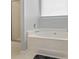 Clean bathroom with shower and soaking tub under a large window at 181 Mott Rd, Mooresville, NC 28115