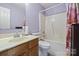 Cozy bathroom featuring a single sink vanity and a shower-tub combo at 181 Mott Rd, Mooresville, NC 28115