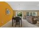 Open dining area with chandelier lighting and sliding glass door to outdoor space at 181 Mott Rd, Mooresville, NC 28115