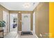 Bright foyer features neutral walls and a view to the bedroom at 181 Mott Rd, Mooresville, NC 28115