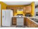 Bright kitchen features oak cabinets, white appliances, and ample counter space at 181 Mott Rd, Mooresville, NC 28115