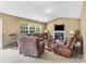 Cozy living room featuring a fireplace, comfortable seating, and large window at 181 Mott Rd, Mooresville, NC 28115