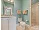 Well-lit bathroom featuring a granite countertop, tiled floor, and glass-enclosed shower at 2129 Halford Pl, Charlotte, NC 28211