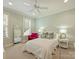 Well-lit bedroom featuring a white bed, pops of color, and neutral decor at 2129 Halford Pl, Charlotte, NC 28211