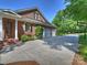Long driveway leading to a three-car garage and a beautifully landscaped home exterior at 2129 Halford Pl, Charlotte, NC 28211