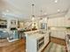 Bright, open kitchen with island, breakfast bar, and stainless steel appliances at 2129 Halford Pl, Charlotte, NC 28211