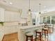 Modern kitchen with white cabinets, marble countertops, and stainless steel appliances at 2129 Halford Pl, Charlotte, NC 28211