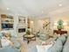 Comfortable living room with fireplace and access to the staircase at 2129 Halford Pl, Charlotte, NC 28211