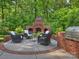 Relaxing outdoor patio with brick fireplace and comfortable seating, perfect for enjoying cool evenings at 2129 Halford Pl, Charlotte, NC 28211