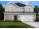 Charming two-story home with gray siding, a two-car garage, and a well-manicured lawn at 2159 Sunflower Cir, Newton, NC 28658