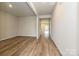Open-concept living room with hardwood floors and plenty of natural light at 2159 Sunflower Cir, Newton, NC 28658