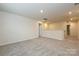Upstairs loft area with carpeted flooring, bright lighting, and easy access to other rooms at 2159 Sunflower Cir, Newton, NC 28658