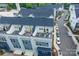 Aerial view showing the private rooftop terraces of modern townhomes and street parking at 2254 Electric Ln, Charlotte, NC 28205
